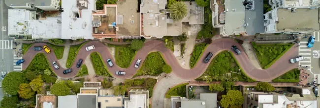 aerial image of lombard street showing twisting road with cars on it