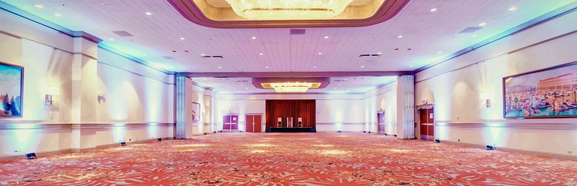 panoramic view of our empty ballroom and stage with highlight lights on