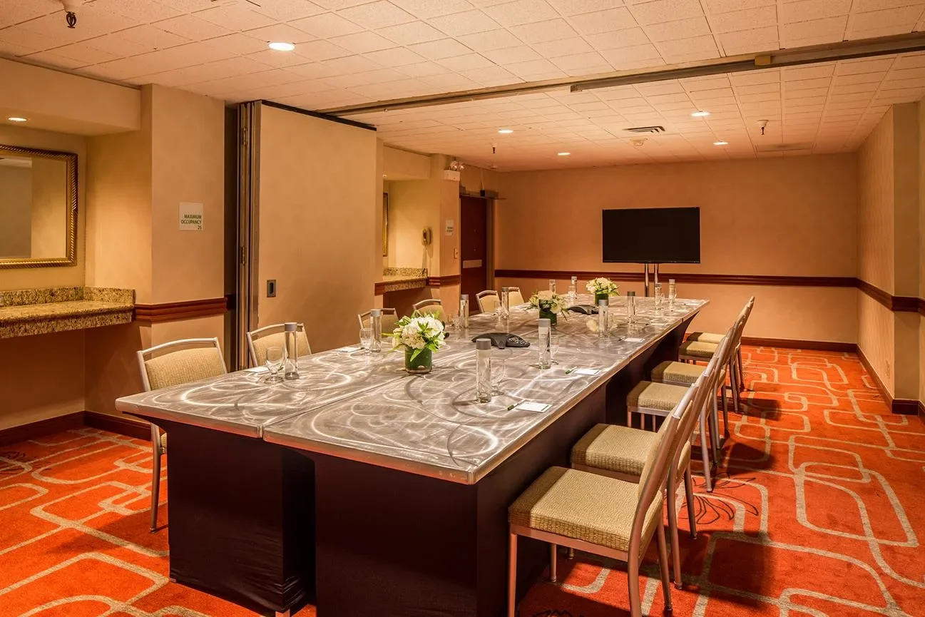 our monterey carmel meeting room showing conference table set up and opened airwall